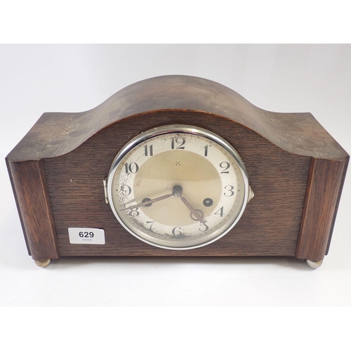 629 - A German 1930's oak cased mantel clock, 33cm wide