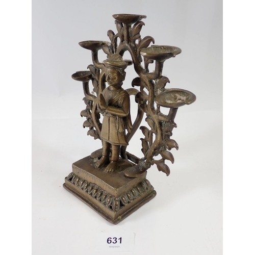 631 - An Indian brass incense burner with praying figure standing by a tree tree holding five oil dishes, ... 