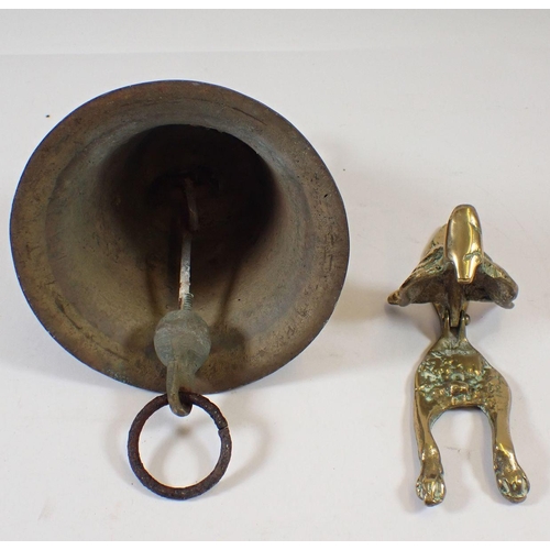 652 - An old bell and a brass fox door knocker, 17cm