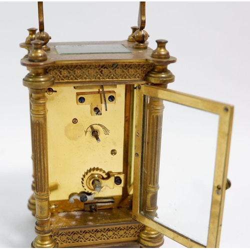 672 - A 19th century fine French brass carriage clock with pierced gilt decoration to front, with key, 12.... 