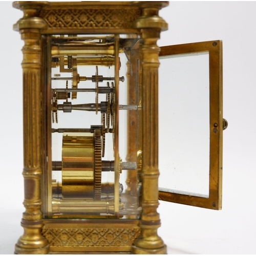 672 - A 19th century fine French brass carriage clock with pierced gilt decoration to front, with key, 12.... 