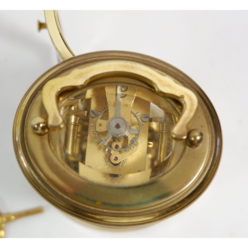 674 - A L'Epee small brass carriage oval clock, cased, 7.5cm tall