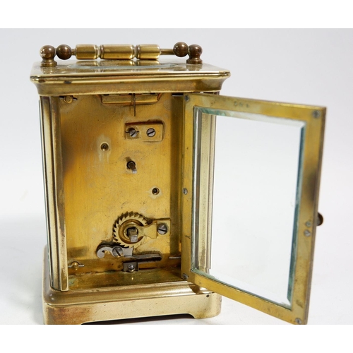 675 - A French brass carriage clock with key, 10.5cm