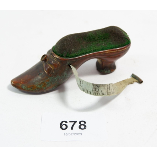 678 - A Victorian novelty shoe pin cushion and tape measure