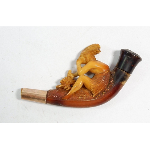 679 - A meerschaum pipe carved Native American figure seated with axe, mounted in gold, mouthpiece missing... 