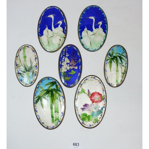 683 - Seven oval Japanese Qibao Shou enamel plaque decorated flowers and birds, larger panels 14 x 8.5cm