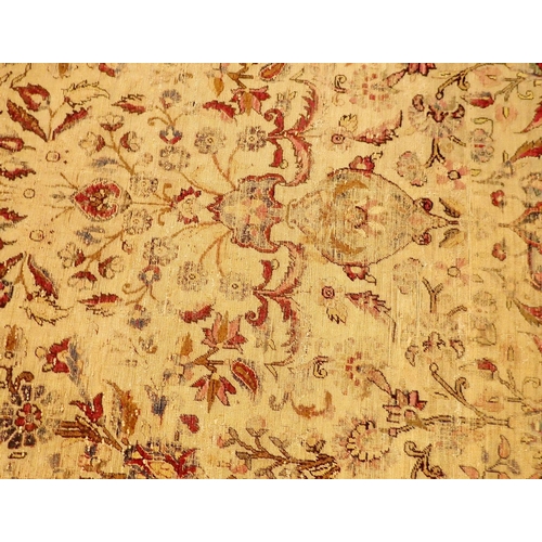 1015 - A Persian antique silk rug with all over floral arch decoration, very worn, 132 x 204cm