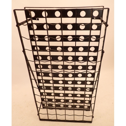 1018 - A Victorian wrought iron wall mounted bottle rack with gridwork for seventy eight bottles of wine, w... 