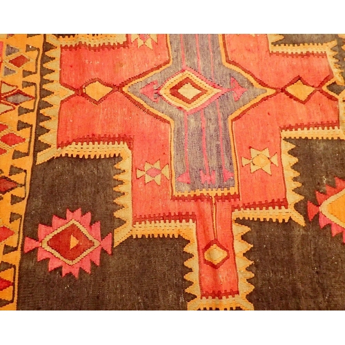 1045 - A Middle Eastern tribal large Kelim hanging rug with brightly coloured geometrical decoration 362 x ... 