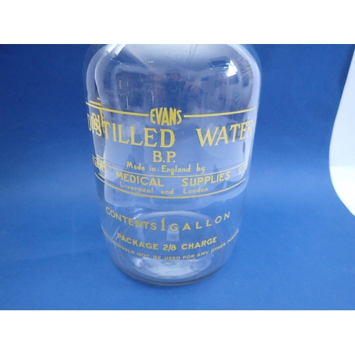 1051 - An Evans advertising distilled water glass gallon jar, 32cm