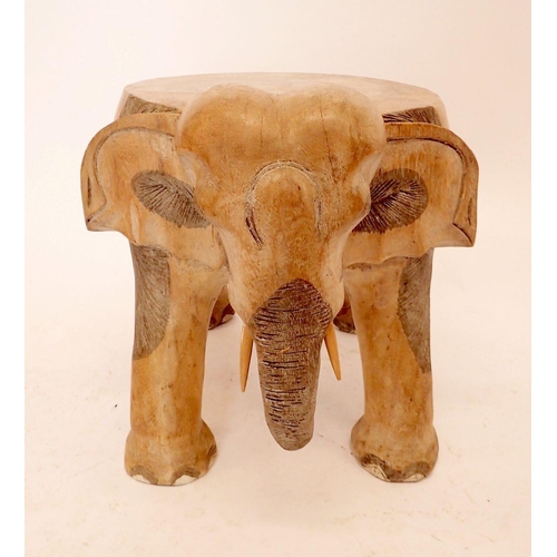 1056 - A carved elephant form stool or occasional table, 31cm high