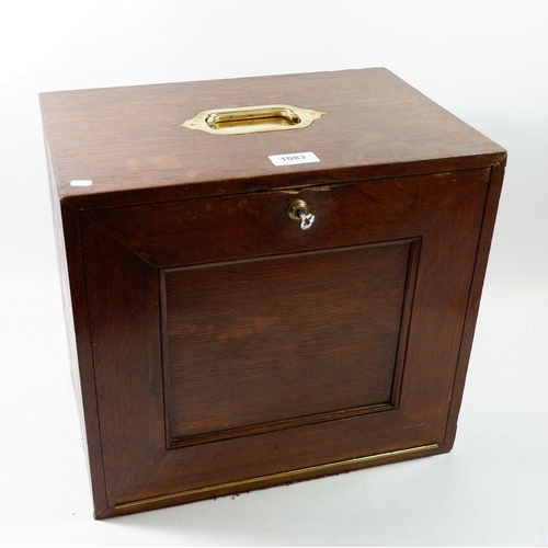 1083 - An Edwardian oak stationary box with inset carrying handle and drop front revealing fitted interior,... 