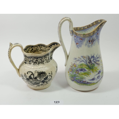 123 - A Swansea jug by J Evans & Co 'Birds' and another black floral printed Swansea jug