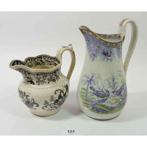 123 - A Swansea jug by J Evans & Co 'Birds' and another black floral printed Swansea jug