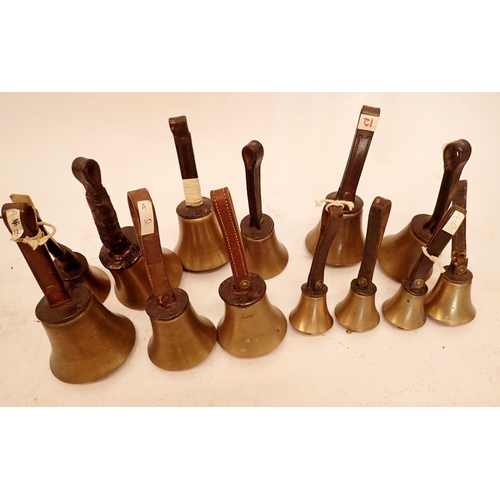 1245 - A set of twenty brass handbells with leather straps (seven missing ringers) eleven marked Mears