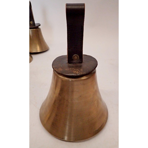 1246 - A good set of forty four brass handbells with leather straps and box of music, all bagged and with w... 