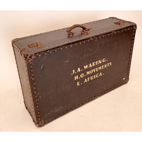 1248 - A vintage trunk 'J A Waring, H Q Movements, E Africa, 80 x 50 x 24cm