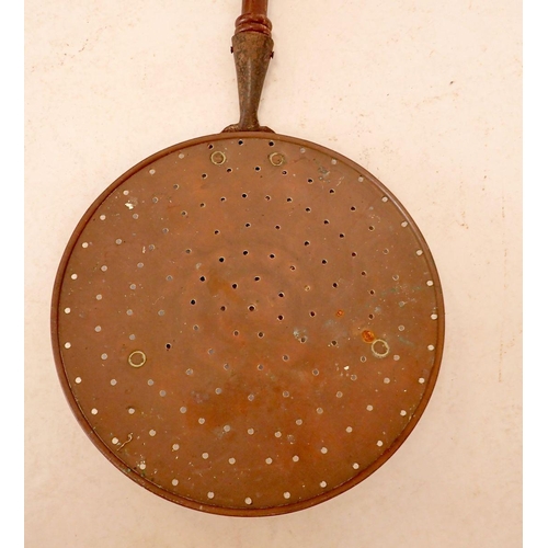 1256 - A 19th century brass chestnut roaster with turned handle