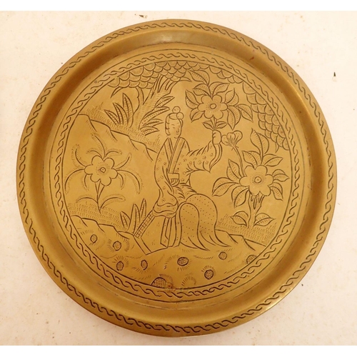 1269 - A copper Persian tray 45cm diameter and a brass Eastern tray