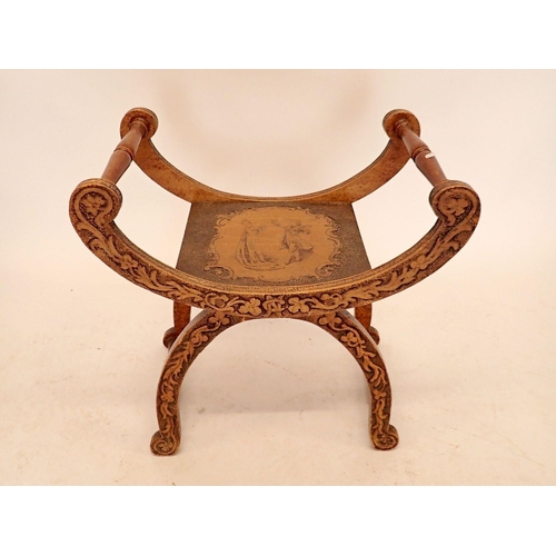 1273 - An Edwardian X frame mahogany stool with pokerwork decoration