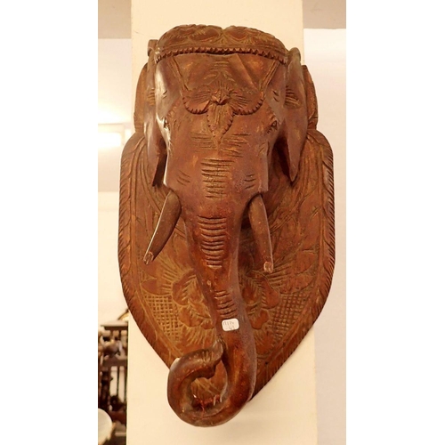 1279 - An Indian carved wood elephant head plaque, approx 48cm