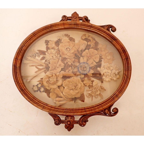 1281 - A Victorian walnut oval glass framed fabric floral collage, 40cm