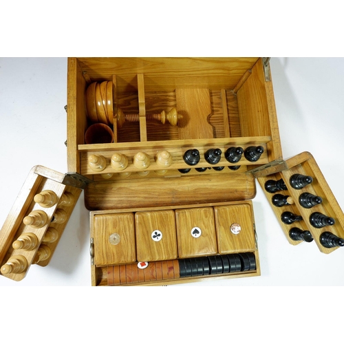 1298 - A Victorian light oak games compendium including chess set, draughts, board, 'Nine Mens Morris' and ... 