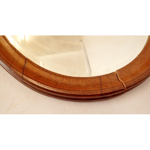 1308 - A 1ate 19th century mahogany framed oval mirror 102 x 70cm