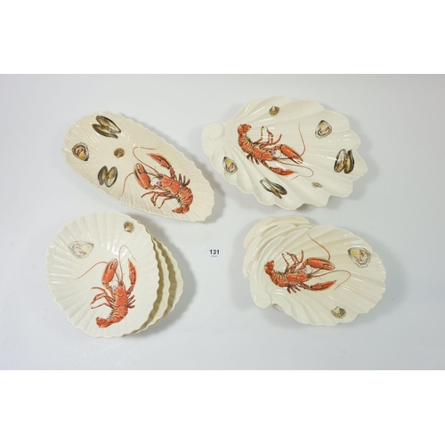 131 - A Royal Winton clam and shell form seafood set consisting of two platters, 28cm long and six various... 