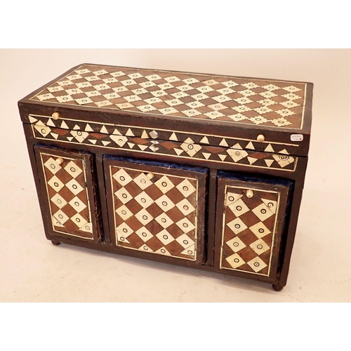 1319 - An Egyptian bone and hardwood apprentice piece miniature chest with rise top and fitted five drawers... 