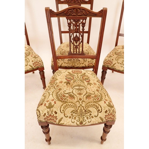 1332 - A set of four Edwardian mahogany side chairs with carved decorative backs