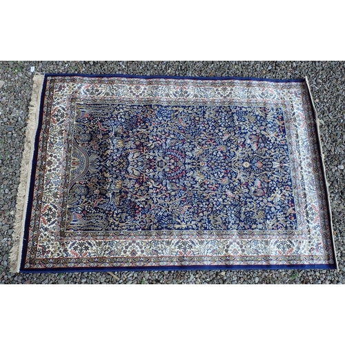 1333 - A full pile Kashmir style rug with tree of life and rich blue ground, 170 x 120cm