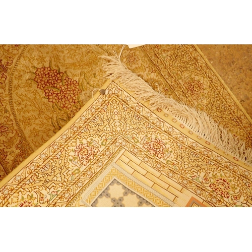 1334 - A small Persian silk prayer rug in cream and gold colours decorated birds and flowers 95 x 63cm