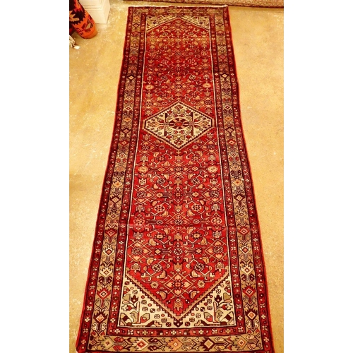 1338 - A Persian Hamadan full pile runner with red ground 326 x 110cm