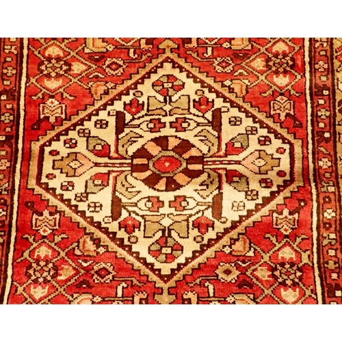 1338 - A Persian Hamadan full pile runner with red ground 326 x 110cm