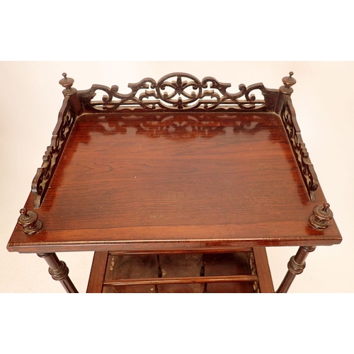 1344 - A Victorian rosewood Canterbury whatnot with fretwork decoration and drawer to base