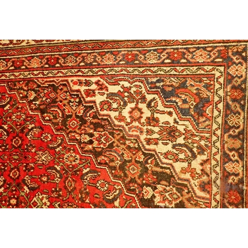 1349A - A Persian Mashad carpet with rich red ground and vintage traditional floral medallions 329 x 219cm -... 