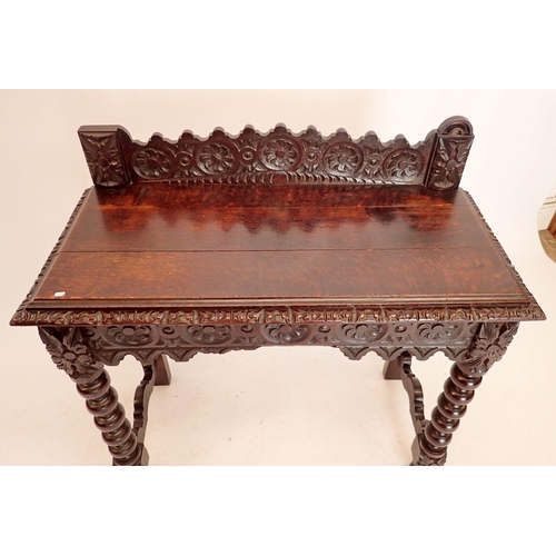 1356 - A Victorian oak Jacobean style hall table with all over carved decoration, end drawer and bobbin tur... 