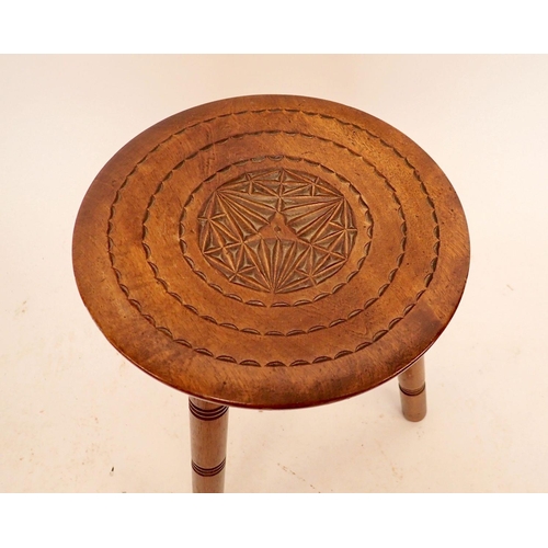 1379 - A Victorian carved three legged stool