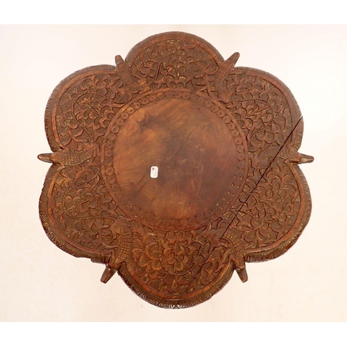 1381 - A Victorian carved and lobed Indian style two tier occasional table, 42cm diameter