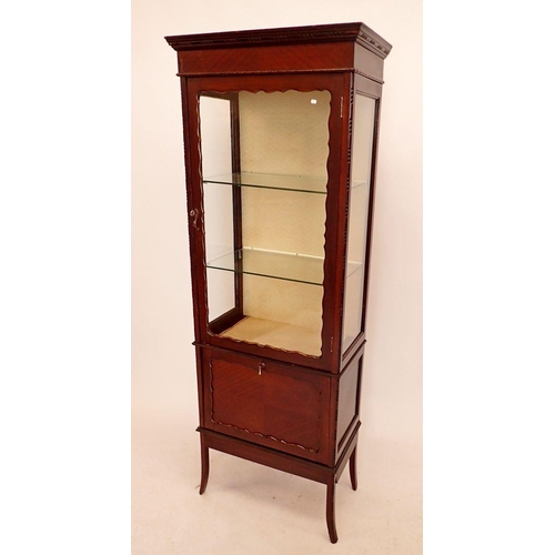 1398 - An Edwardian mahogany display cabinet with single door over pull out magazine rack, 62cm wide