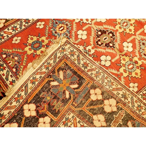 1400 - A Turkoman antique rug with stylised floral motifs on a madder ground and blue floral borders, 130 x... 