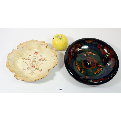 142 - A pottery bowl with stylised floral decoration, a Crown Ducal bowl and an orange preserve pot