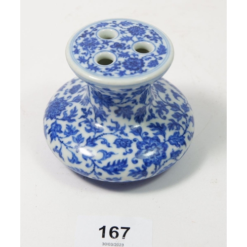 167 - A Chinese Imperial style blue and white incense burner with scrolling floral motifs 