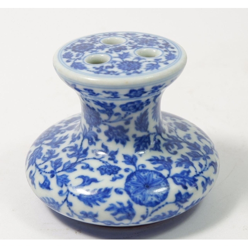 167 - A Chinese Imperial style blue and white incense burner with scrolling floral motifs 