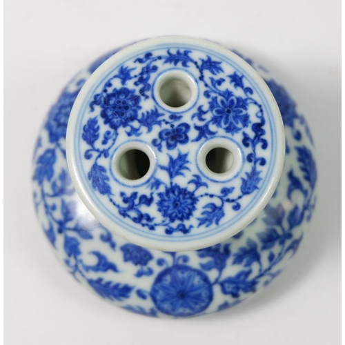 167 - A Chinese Imperial style blue and white incense burner with scrolling floral motifs 