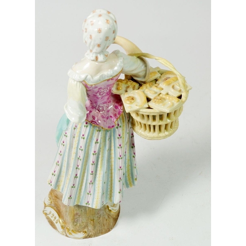 200 - A 19th century Meissen porcelain Cris de Paris figure of a pastry seller, 19cm tall, blue crossed sw... 