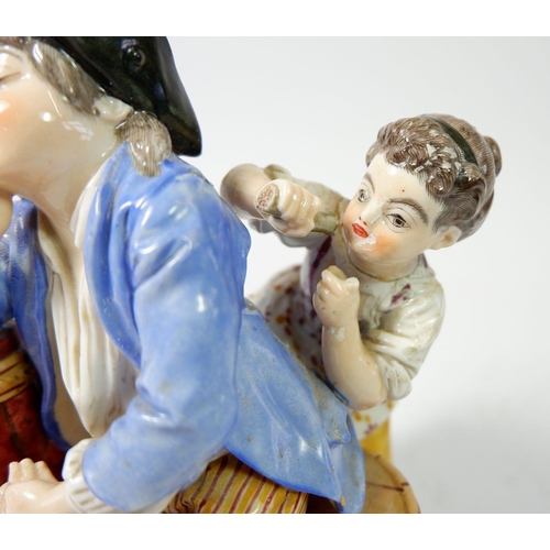 205 - A 19th century porcelain group of young girl surprising sleeping boy, 18cm