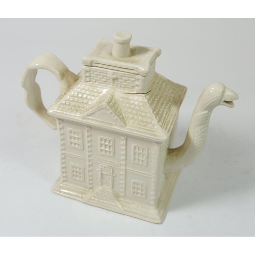 206 - A Staffordshire salt glazed white stoneware press moulded house form teapot with bird head spout 15c... 