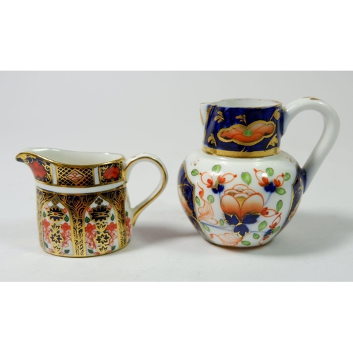 207 - A Victorian miniature Royal Crown Derby Imari jug and a later one, pattern 1128